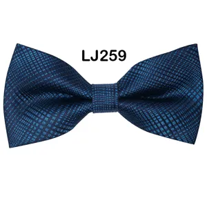 Blue jacquard bow tie detail shot, exquisite texture and classic shape for formal wear.