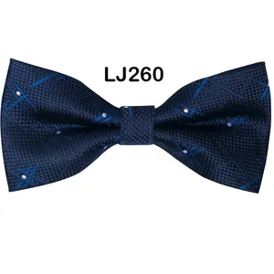Dark blue men's bow tie with star jacquard pattern, detailed close-up shot of texture.