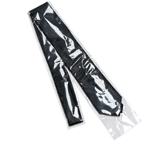 Detail shot of black jacquard pattern men's business tie in clear protective bag.