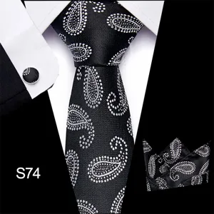 Gedetailleerd overzicht van zwart-wit paisley patroon heren zakelijke stropdas pochet set
