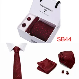 Detail view of the red dotted tie, pocket square, cufflinks and gift box set for men's suits.