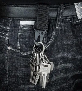 Black tactical carabiner keychain clip, durable zinc alloy outdoor gear detail shot.