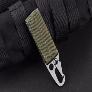 Detail shot of tactical backpack hook, zinc alloy carabiner with green webbing strap