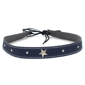 Close-up detail of dark leather hat band with silver star, studs and white contrast stitch.