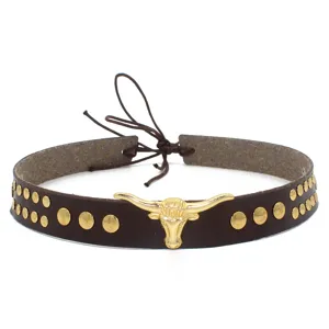 Western style brown leather hat band detail featuring golden bull head and metal studs.