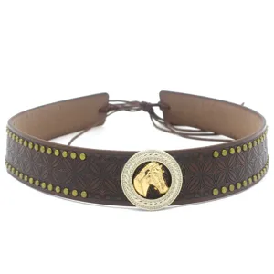 Vintage western brown leather hat band with golden horse head buckle and metal stud accessories.