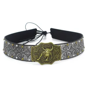 Retro western cowboy bull head belt decorative strap detail shot, vintage leather and metal.