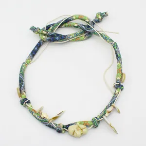 Boho fabric hat band with shells and beads, detailed ethnic strap for fedora or necklace.