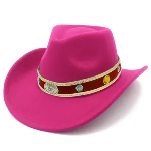 Close-up of hot pink wool western cowboy hat, decorative band with metal medallions.