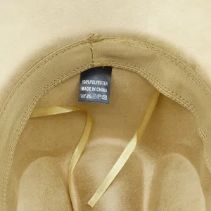 Close-up interior detail of faux suede fedora hat showing material label and lining.