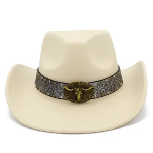 Close-up of beige cowboy hat detail featuring ornate vintage pattern band and brass bull head.