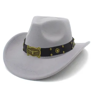Close-up detail of grey felt western cowboy hat with metal longhorn skull buckle and star studs.