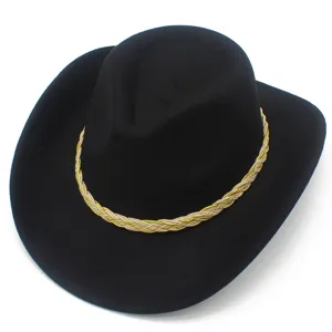 Close-up detail of a classic black western cowboy hat with a stylish braided gold and beige band.