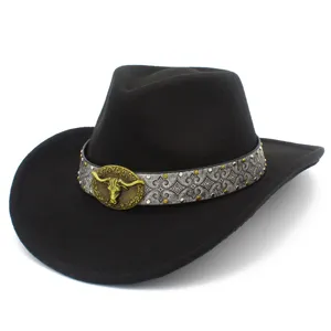 Close-up detail of the vintage black western cowboy hat featuring a striking metallic bull head buckle.