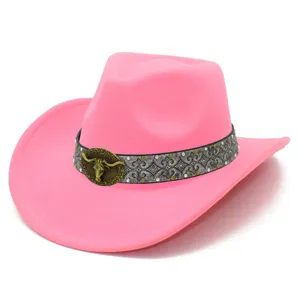 Pink western cowboy hat detail, featuring silver patterned band and vintage bull head metal badge.