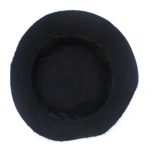 Top view detail showing the black inner lining and colorful outer brim print of the bucket hat.