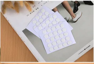 Transparent round double-sided adhesive glue dots for effortless crafting and home decor use.