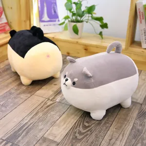 Detailed view of cute and chubby plush dog pillows displayed on a wooden floor in a cozy room.