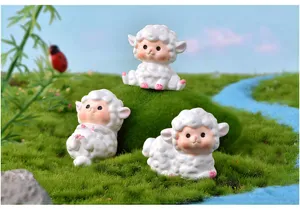 Detail view of cute resin sheep miniature figurines for moss landscape and succulent decor.