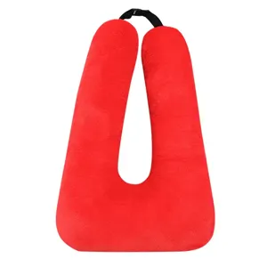 Red plush U-shaped pillow multi-functional car neck travel cushion and toy for comfort sleeping.