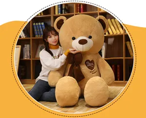 Large plush teddy bear with bow and heart love embroidery, soft huggable giant doll gift.