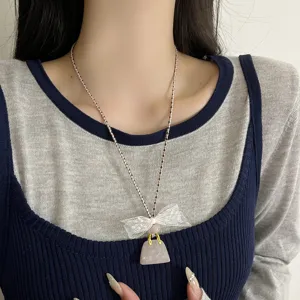 Chic lace bow handbag pendant necklace, delicate clavicle chain for women daily wear.