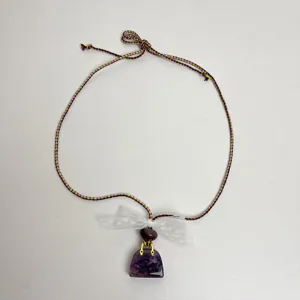 Chic lace bow necklace featuring a purple crystal pendant and braided cord for women.