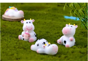 Resin cute cow and unicorn miniatures detail shot for micro landscape moss decoration.