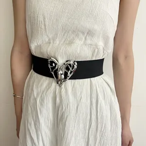 Black elastic waist belt featuring a silver heart metal clasp, stylish fashion accessory.