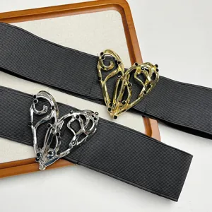 Vintage black elastic belt featuring a chic irregular metal heart buckle with rhinestone details.