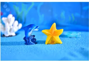 Conjunto de adornos de resina de estilo mediterráneo con delfín y figuras de estrella.