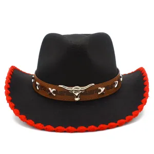 Detailed view of black western cowboy hat with metal bull skull and red brim trim.