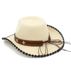 Close-up detail of beige western cowboy hat featuring brown leather band and black edge.