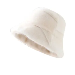 Women winter plush bucket hat, thick warm faux fur fisherman cap in elegant white.