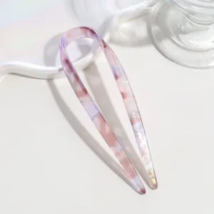 Minimalist pink gradient U-shaped hair fork for elegant everyday updo styling details