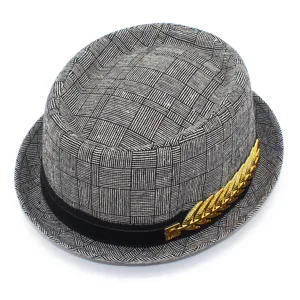 Stylish black and white plaid fedora hat with elegant gold leaf decoration and black band.