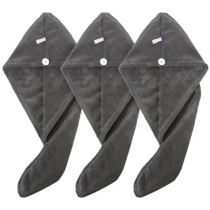 Grey coral fleece hair drying towel detail, soft texture with white button and loop close-up.