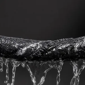Detailed close-up shot of thick absorbent pet towel showing water absorption and dripping feature.