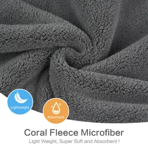 Closeup texture of soft coral fleece microfiber fabric showing absorbent and lightweight design.