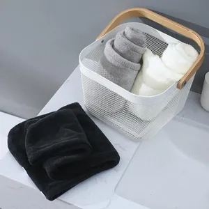 Coral fleece hair drying cap detail view, ultra-absorbent quick dry towel in storage basket.