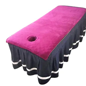Detailed view of microfiber beauty bed cover with face hole, pink top and striped skirt.