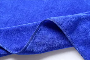 Detail shot of royal blue microfiber towel showing soft texture and stitched edge quality.