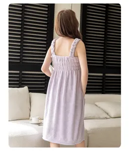 Coral fleece wearable bath towel dress back view detail in soft home setting, cozy texture.