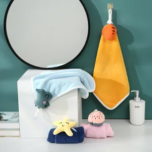 Soft coral fleece hand towel set with cute plush animal pendants, highly absorbent for daily use.