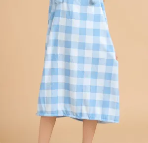 Close-up detail of the blue and white checkered coral fleece wearable bath towel dress.