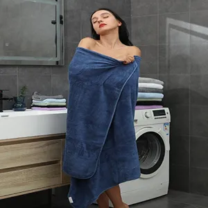 Thickened coral fleece bath towel, super absorbent and soft for daily home and hotel use.