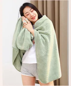 Soft coral fleece bath towel and nap blanket, solid color cozy shawl for home and office use.