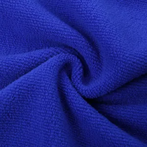Microfiber towel fabric detail, royal blue texture close up, soft cleaning cloth surface