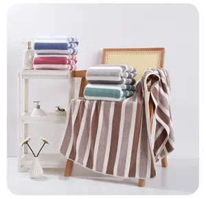 Suave toalla de rayas de felpa coral para baño y cara, altamente absorbente transpirable textil hogar.