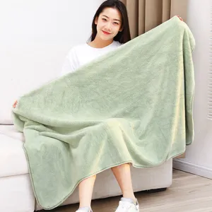 Soft coral fleece bath towel and nap blanket for home and office, cozy solid green design.